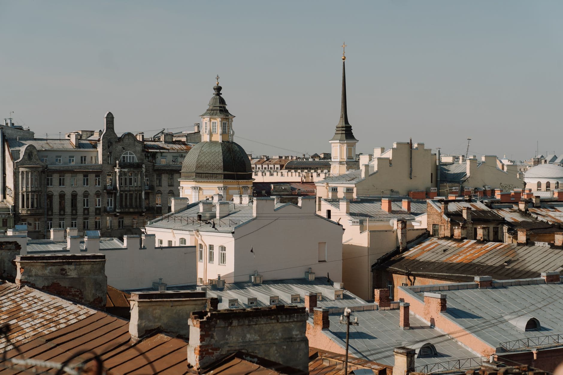 A scenic view of historical European rooftops under a clear sky, capturing classic architecture.
