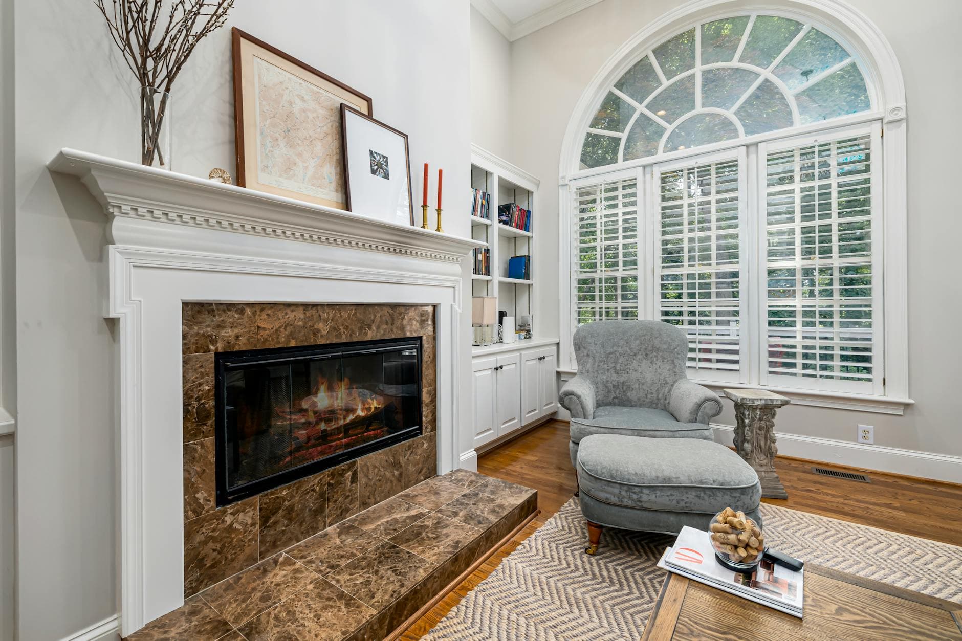 Luxurious modern living room interior featuring an elegant fireplace and comfortable seating.
